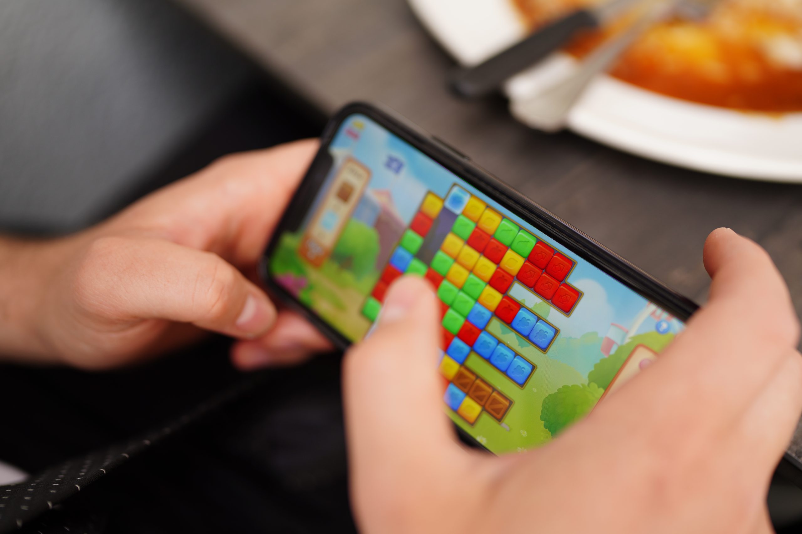 Close Up Person Using Mobile Phone Scaled